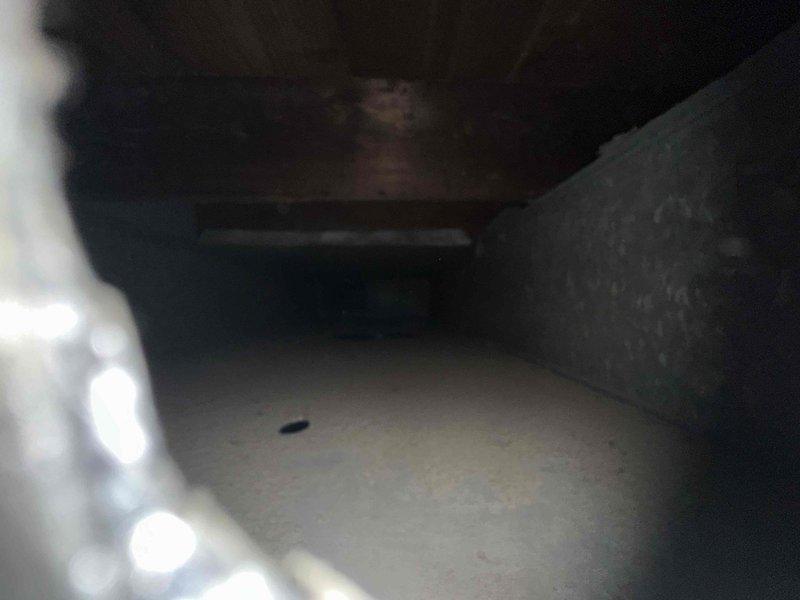 Performed comprehensive duct cleaning service for residential HVAC system. Pre-inspection revealed significant accumulation of dust, lint, and particulate matter throughout the ductwork, with heavy buildup on metal surfaces and bottom channels. Completed thorough cleaning of all accessible duct sections, removing accumulated debris and restoring proper airflow capacity throughout the ventilation system.