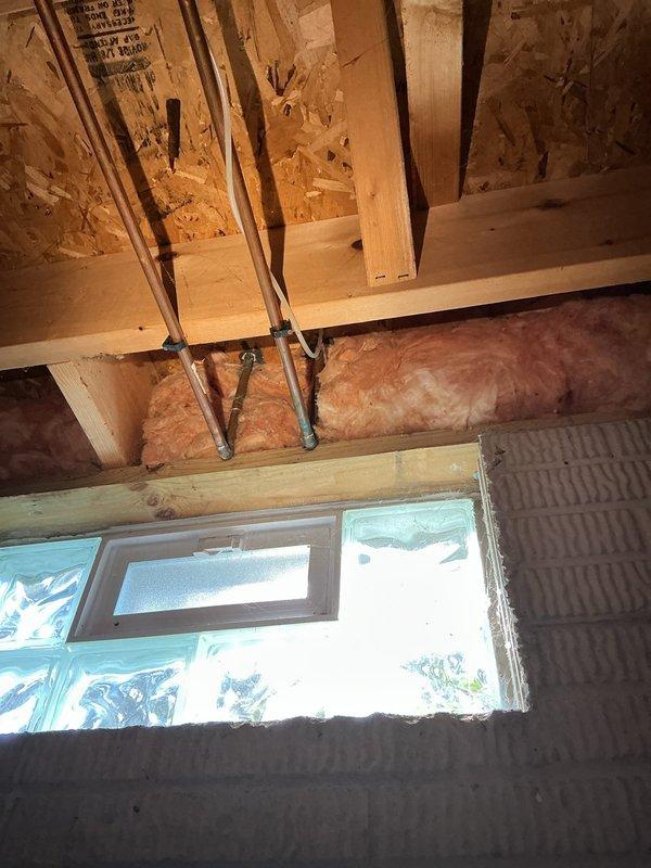 Installed water supply line for new stainless steel side-by-side refrigerator. Routed copper piping from existing plumbing infrastructure through basement ceiling joists to kitchen location, securing lines with appropriate mounting brackets to ensure proper support and code compliance.