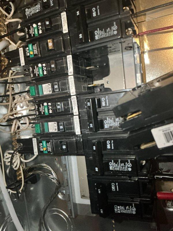 Responded to emergency service call for multiple kitchen appliances without power and sparking electrical panel. Upon arrival, found dishwasher, microwave, and garbage disposal all inoperative due to complete power loss. Inspection revealed dangerous sparking condition at main electrical panel requiring immediate attention for safety. De-energized affected circuits and assessed panel condition. Identified faulty breaker connections and compromised wiring causing arcing and power interruption to kitchen circuits. Performed necessary repairs to electrical panel, secured all wire connections, and replaced damaged breaker components. Restored power to all affected appliances and verified proper operation. Tested panel for proper functionality and confirmed elimination of sparking hazard. All circuits now operating safely within normal parameters.