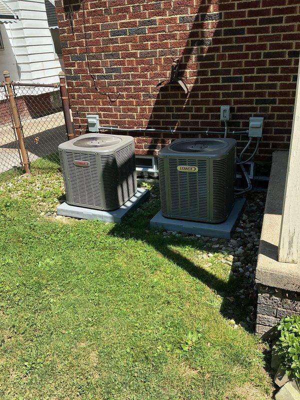 Responded to service call for 3-year-old Lennox WT 12-2032 central air conditioning system on second floor with reported blower fan failure and frozen refrigerant line at outdoor condenser unit. Upon arrival, accessed furnace cabinet and inspected blower motor assembly, electrical connections, and gas valve wiring for proper operation. Confirmed blower motor functionality and verified all electrical connections were secure with no signs of overheating or component failure. Proceeded to outdoor unit and identified frozen suction line on Lennox condenser, indicating restricted airflow or low refrigerant charge. Inspected both outdoor units positioned on concrete pads against structure, noting condenser coil condition and proper clearances. Determined frozen line was caused by restricted airflow due to dirty evaporator coil inside air handler. Powered down system to allow ice buildup to thaw completely. Removed and cleaned evaporator coil, removing dust and debris accumulation that was bl