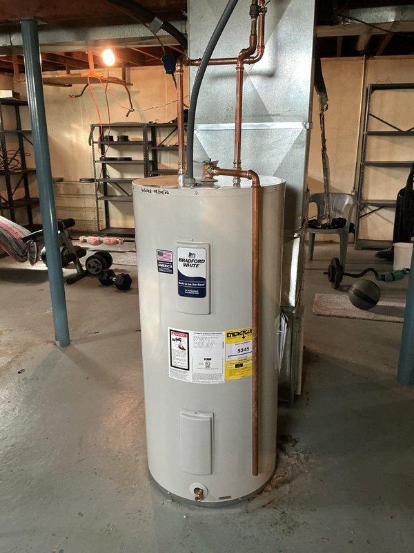 Removed existing 40-gallon gas water heater and installed new 40-gallon electric water heater in basement location. Installed 240-volt electrical circuit to power unit, capped 3-inch flue penetration at chimney, and capped gas supply line at previous connection point. Repositioned water heater orientation to face rear of residence and connected copper supply piping with shutoff valves. Unit tested and verified operational upon completion.