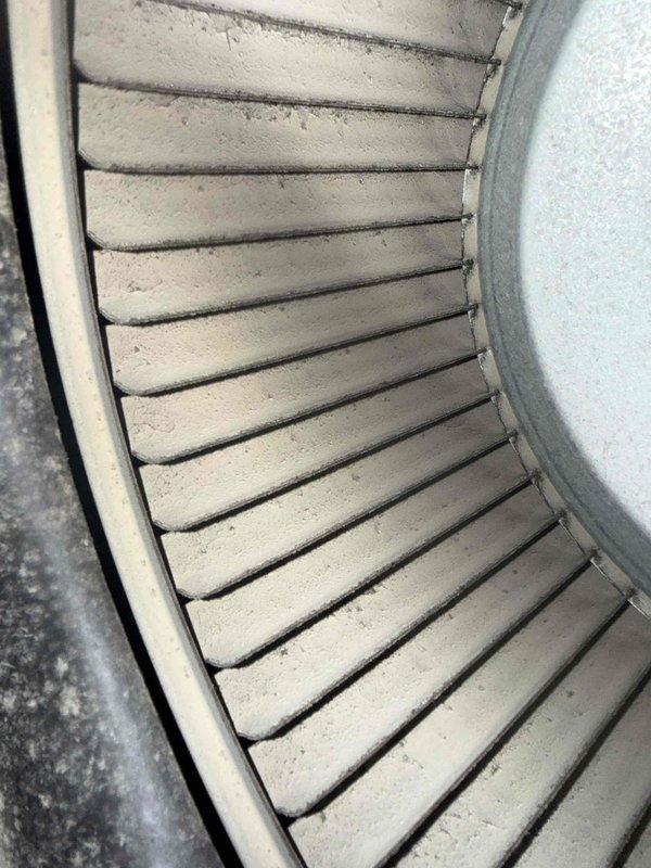 Completed scheduled maintenance visit for MVP customer on 13-year-old air handler unit. Performed thorough inspection of blower assembly, revealing moderate dust and debris accumulation on blower wheel blades and housing. Inspected evaporator coil and found aluminum fins in serviceable condition with dust buildup present on coil face and drain pan. Documented equipment condition with photos for maintenance records.