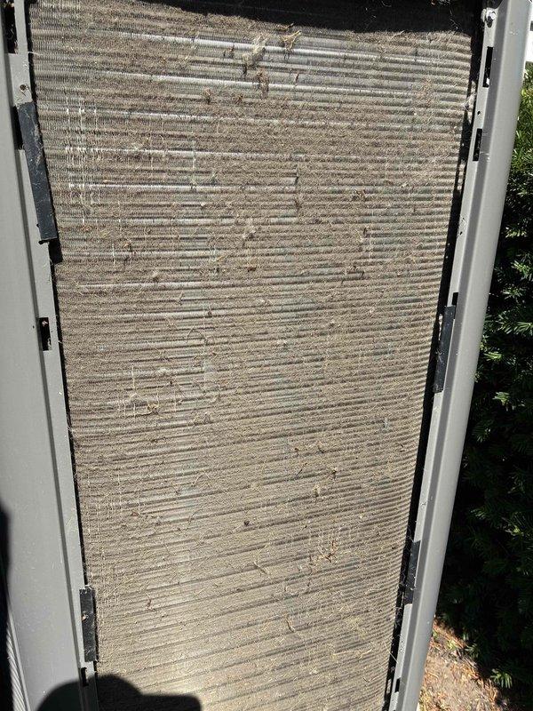Completed routine BS-MVP cooling maintenance visit on a 4-year-old Lennox air conditioning system. Inspected evaporator coil and found significant accumulation of dirt, dust, and debris throughout the aluminum fins, with heavy buildup in concentrated areas affecting heat transfer efficiency. Cleaned condenser unit and performed standard maintenance procedures on the outdoor equipment. System operational upon completion. Documented equipment condition with photographs for service records.