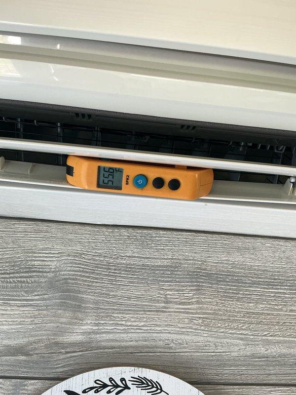 Completed comprehensive tune-up on Mitsubishi Electric split-system heat pump (Model MUZ-GL12NA) located at rear of property. Performed internal inspection of wall-mounted unit, verified operational temperature readings at 55.5°F, and confirmed all system components, labels, and safety warnings are intact and functioning properly.