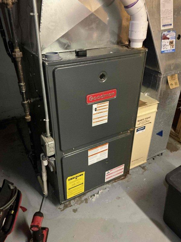 Responded to water leak complaint on 20-year-old Goodman HVAC system. Upon arrival, performed comprehensive inspection of indoor furnace unit and outdoor condenser to identify source of water leakage. Inspected condensate drain system, evaporator coil assembly, drain pan, and associated PVC drainage piping for blockages or failures. Examined outdoor unit for proper operation and verified refrigerant lines for excessive condensation. Cleared debris from around outdoor condenser unit and checked for proper airflow. System evaluated and customer advised of findings regarding age-related component wear on this two-decade-old installation.