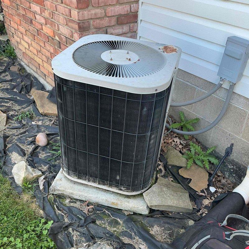 Responded to water leak complaint on 20-year-old Goodman HVAC system. Upon arrival, performed comprehensive inspection of indoor furnace unit and outdoor condenser to identify source of water leakage. Inspected condensate drain system, evaporator coil assembly, drain pan, and associated PVC drainage piping for blockages or failures. Examined outdoor unit for proper operation and verified refrigerant lines for excessive condensation. Cleared debris from around outdoor condenser unit and checked for proper airflow. System evaluated and customer advised of findings regarding age-related component wear on this two-decade-old installation.
