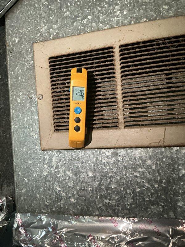 Responded to customer concern regarding air conditioning unit cycling on and off frequently. Performed diagnostic temperature measurements at supply and return vents, recording 71.1°F at return and 73°F at supply register. Verified unit is maintaining cooling functionality and achieving adequate temperature differential. System operating as designed with no immediate service concerns identified at time of inspection.
