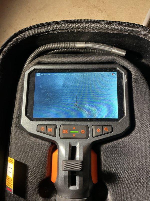Completed scheduled BS-MVP cooling maintenance visit on 12-year-old outdoor air conditioning unit. Performed comprehensive system inspection using borescope camera to examine internal components and ductwork for debris, blockages, and overall condition. Unit operating within normal parameters following routine maintenance procedures.
