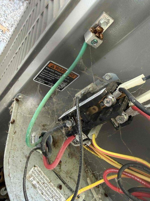 Completed scheduled maintenance on 5-year-old air conditioning system. Accessed and inspected electrical compartment, noting accumulation of cobwebs and debris around wiring connections and terminal blocks; cleaned compartment and verified all electrical connections were secure despite minor corrosion observed on terminal lugs. Applied Flow Treat drain line treatment tablets to condensate drain system to prevent clogs and maintain proper drainage throughout cooling season.