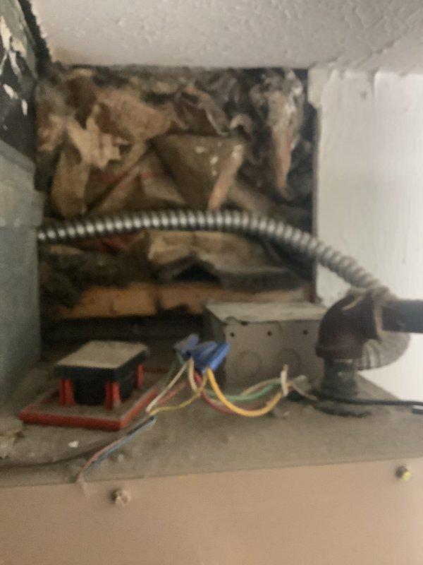 Completed HVAC estimate for package unit replacement at residential property. Assessed existing electrical infrastructure including junction box, disconnect switch, and flexible conduit routing. Documented current wiring configuration, wall cavity conditions, and equipment connections to provide accurate specifications for 8-ton package unit replacement system.