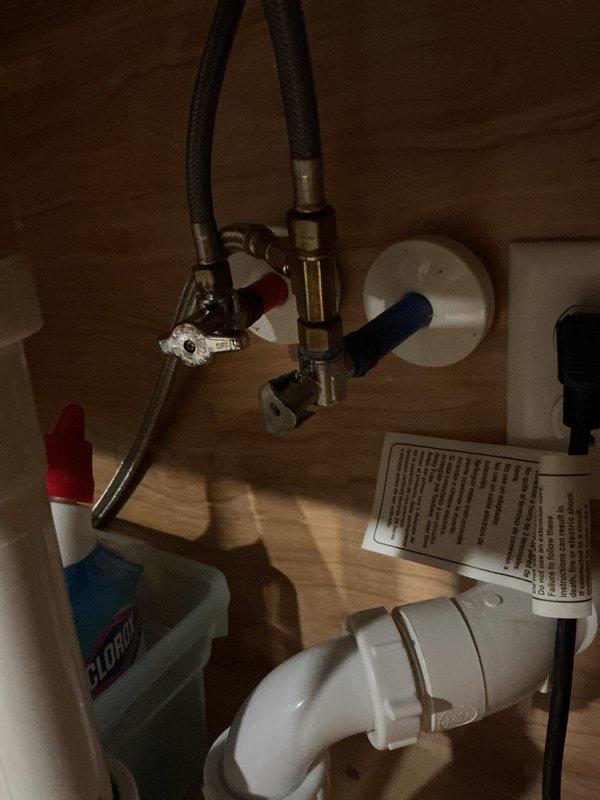 Performed routine maintenance flush on Rinnai tankless water heater unit. Circulated descaling solution through the system using pump and collection bucket setup, removing mineral deposits and sediment buildup to restore optimal heating efficiency and extend equipment lifespan.