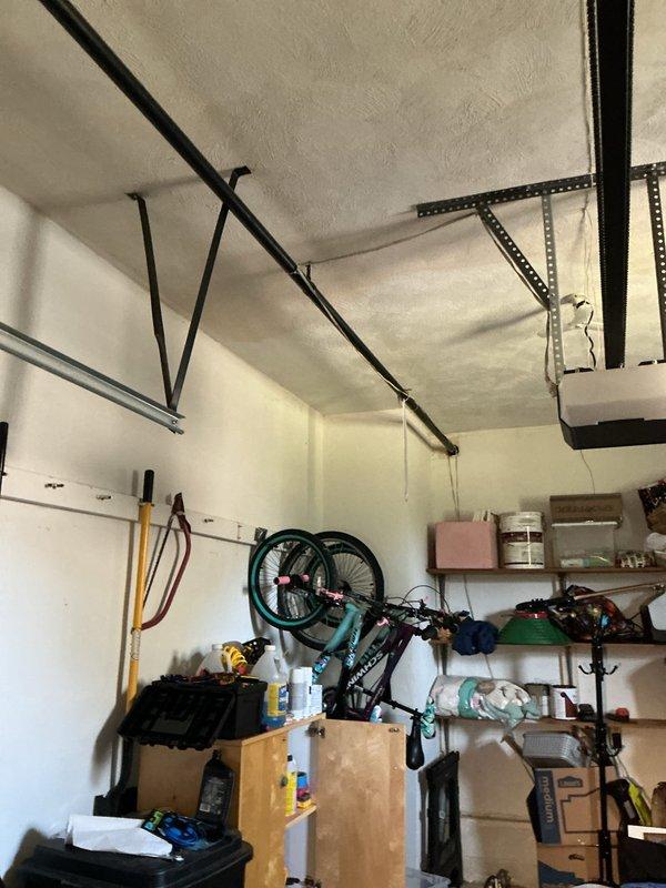 Responded to gas line repair call at 74-year-old residential property. Upon inspection, identified severely corroded metallic gas pipe in basement area with significant rust deterioration at joints and along vertical run. Assessed structural mounting and proximity to existing PVC plumbing lines. Completed necessary repairs to restore safe gas line operation, ensuring all connections met current code requirements. No additional parts required for completion. Documented existing conditions and completed repairs with photographic evidence showing pre-repair corrosion and workspace configuration in basement and garage storage areas.