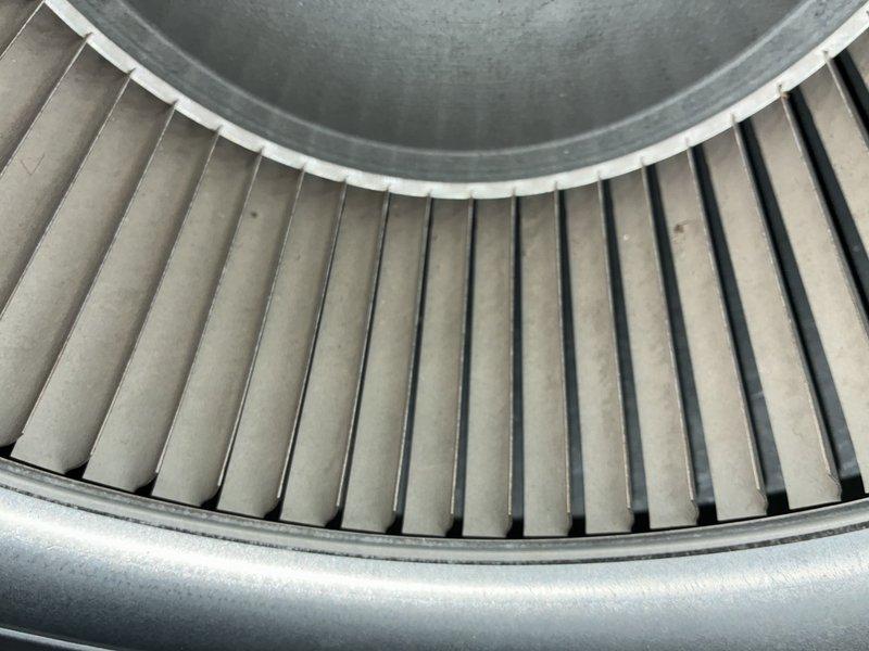 Completed preventative maintenance on 7-year-old air conditioning system as part of recurring MVP cooling service. Inspected blower wheel assembly and squirrel cage fan, confirming proper operation and cleanliness of internal components. Examined air filter which showed moderate dust accumulation; filter pleats maintained structural integrity and remained functional within acceptable service parameters.