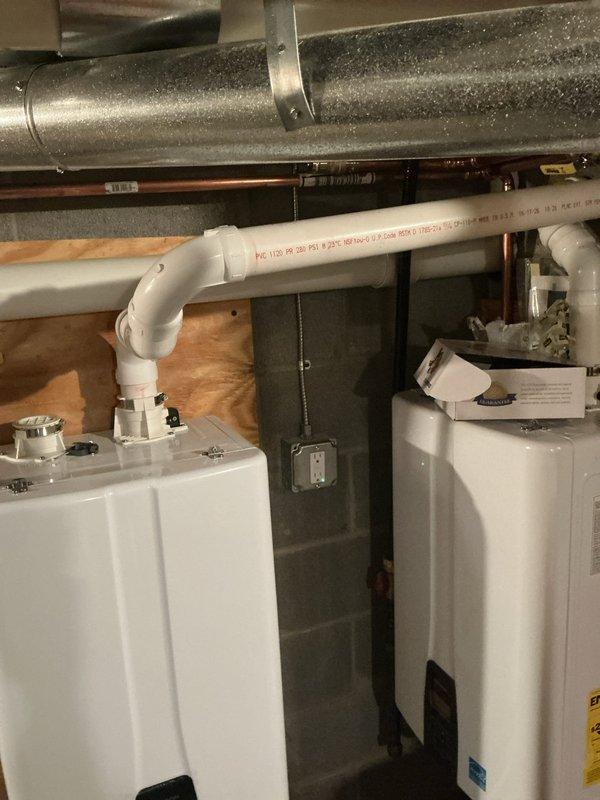 Installed dedicated electrical circuits for two tankless water heaters in accordance with manufacturer specifications and local electrical code requirements. Routed electrical conduit and wiring through attic space and down to mechanical room location, securing all runs to structural members and maintaining proper clearances from HVAC ductwork and plumbing lines. Completed power wiring installation (PWI) with appropriate wire gauge for tankless unit amperage demands, verified proper grounding, and ensured all connections meet safety standards for high-draw appliances.