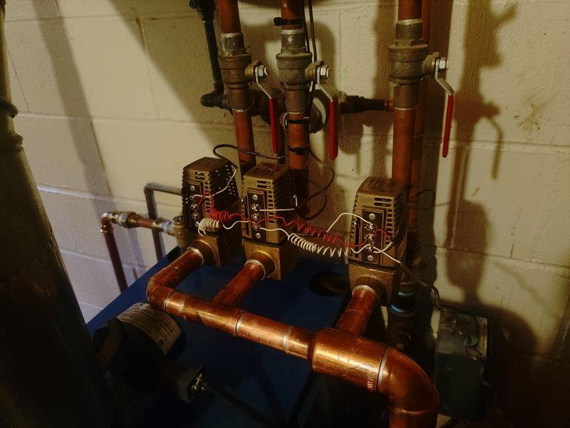 Successfully replaced all three zone valves on the boiler heating system with new Taco zone valves, maintaining the existing wiring configuration. Removed the old corroded zone valves from the copper manifold system and installed new units with proper electrical connections to ensure independent zone control. Additionally, replaced the failing Extrol expansion tank to restore proper system pressurization and prevent future operational issues. All copper connections were properly soldered, tested for leaks, and verified for proper operation. System was pressurized, purged of air, and each zone was individually tested to confirm proper valve operation and flow control.