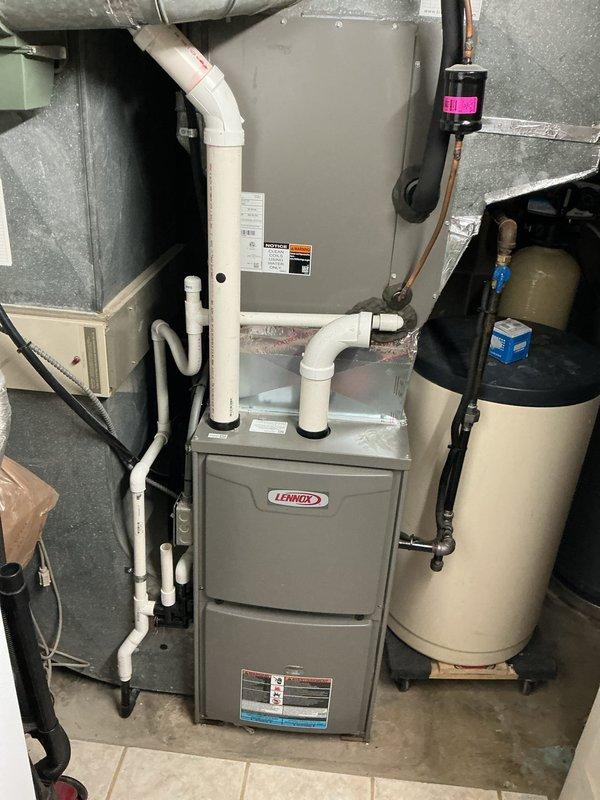 Completed preventive maintenance cooling visit on residential Lennox HVAC system with auxiliary air handler. Performed standard system diagnostics including electrical measurements with multimeter to verify proper voltage and amperage across components. Inspected furnace, air handler, PVC condensate drainage lines, and associated ductwork. All equipment operating within normal parameters. System ready for continued cooling season operation.