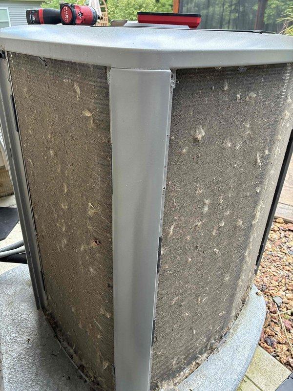 # HVAC Maintenance - Cooling Service

Completed routine cooling system maintenance on 6-year-old residential air conditioning unit. Performed comprehensive inspection of outdoor condenser unit, noting significant accumulation of dirt, dust, and debris on exterior mesh filters and coil surfaces. Cleaned condenser coils and protective grilles to restore proper airflow and system efficiency, addressing the heavy buildup that can restrict heat transfer and reduce cooling capacity. Verified unit operation, checked refrigerant levels, and ensured all components were functioning within normal parameters to maintain optimal performance throughout the cooling season.