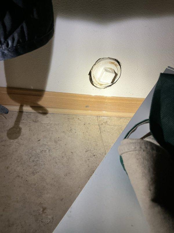 Responded to service call for toilet backing up. Upon arrival, inspected toilet and drainage system. Utilized drain cleaning equipment to clear blockage in toilet drain line. Accessed plumbing system through wall access point to ensure proper flow and verify clearance of obstruction. Successfully restored toilet to full operational capacity with proper flushing and drainage confirmed before completion.