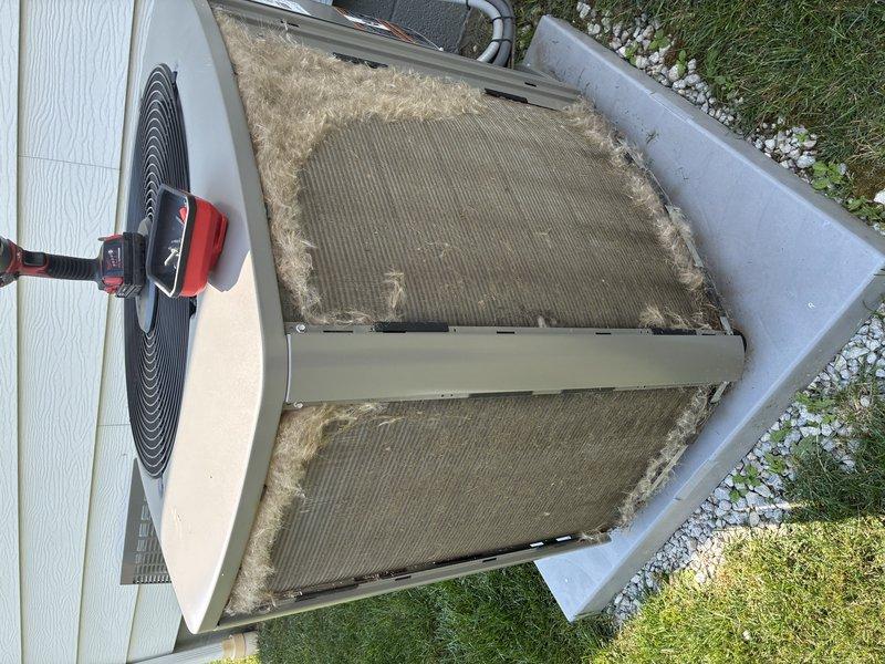 Completed MVP cooling maintenance visit on residential air conditioning system. Unit inspection revealed significant dirt and debris accumulation on condenser coils and grille surfaces, which were documented through photographs. Performed standard preventive maintenance procedures including visual assessment of condenser fan operation, evaluation of component condition, and documentation of cleaning requirements to maintain optimal system efficiency.