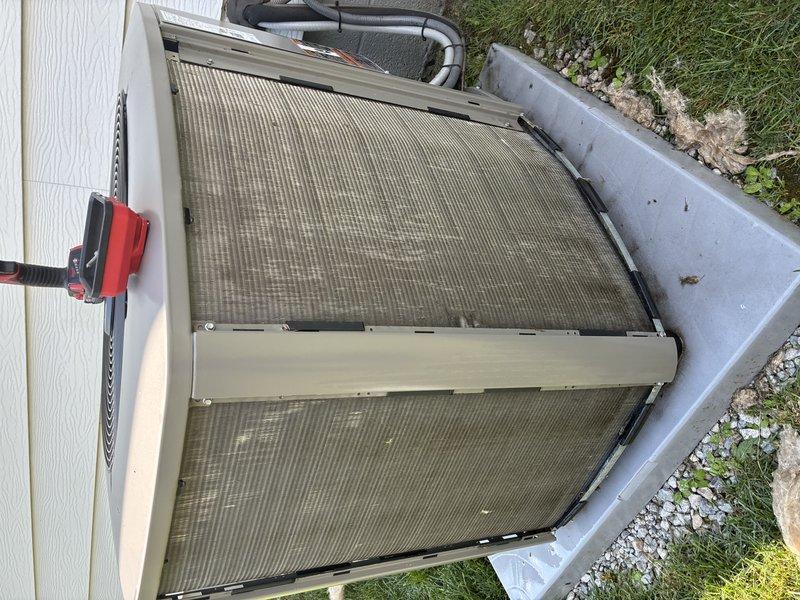 Completed MVP cooling maintenance visit on residential air conditioning system. Unit inspection revealed significant dirt and debris accumulation on condenser coils and grille surfaces, which were documented through photographs. Performed standard preventive maintenance procedures including visual assessment of condenser fan operation, evaluation of component condition, and documentation of cleaning requirements to maintain optimal system efficiency.