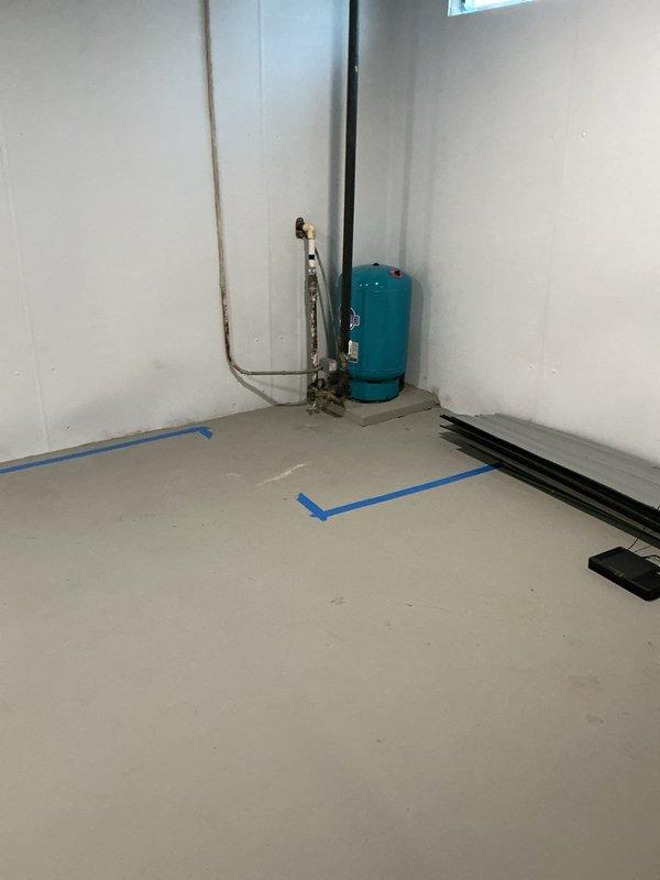 Conducted on-site assessment for water filtration system installation at residential property. Evaluated existing water softener unit with digital control panel and pressure tank system, documented current plumbing configuration including copper supply lines and valve connections, and photographed utility room layout to provide comprehensive estimate for upgraded water treatment solutions.