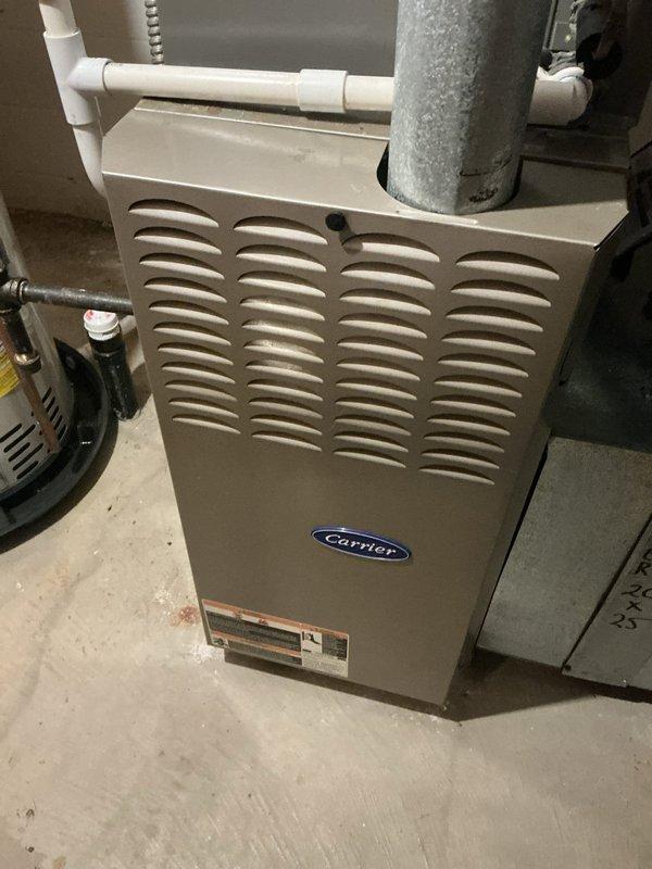 Completed routine AC maintenance on Carrier system. Inspected outdoor disconnect box and electrical connections, verified proper operation of indoor furnace unit, and documented all components functioning within normal parameters. All safety checks passed and system operating efficiently.
