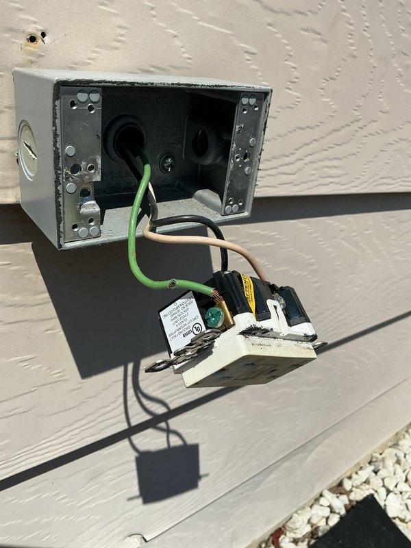 Responded to no power condition in garage caused by exterior GFCI outlet serving pool equipment. Found outlet repeatedly tripping due to moisture intrusion and compromised wiring connections in exterior junction box. Replaced damaged GFCI receptacle, secured all wire connections, and verified proper grounding. Tested circuit under load and confirmed power restored to garage panel and all affected outlets without further tripping.