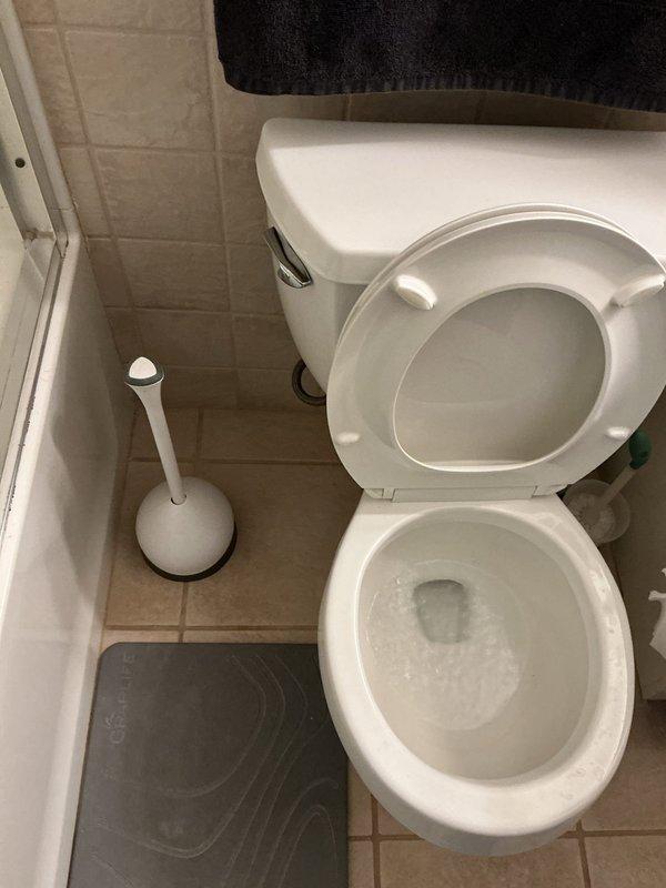 Responded to service call for multiple drainage issues in residential property. Addressed clogged toilet in basement that was experiencing repeated backup conditions. Inspected and cleared slow-draining shower in basement area. Investigated strong sulfur odor reported in main floor bathroom, which typically indicates bacterial buildup in drain lines or potential issues with P-trap integrity. Examined sump pump basin installation and associated drainage piping during basement assessment. Verified proper operation of plumbing fixtures and drainage systems throughout affected areas following service completion.