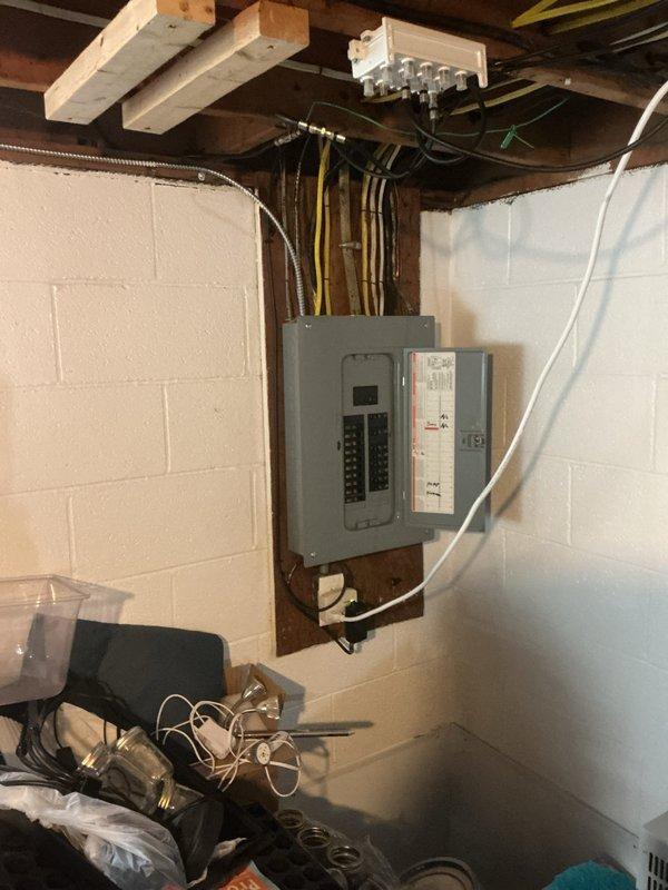 Responded to electrical short in hallway lighting circuit. Inspected electrical panel and wiring connections in basement utility area, traced circuit pathways through exposed joists, and identified faulty connection causing intermittent short. Repaired wiring defect, verified proper circuit operation, and confirmed all hallway lights functioning correctly without further issues.