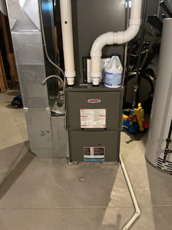Completed routine cooling maintenance on a 9-year-old Lennox AC system. Inspected furnace and air handler components in basement mechanical room, checked electrical connections and contactor in disconnect box, verified proper operation of all system components including ductwork and PVC condensate piping. System operating properly with no issues found; all components within normal parameters.