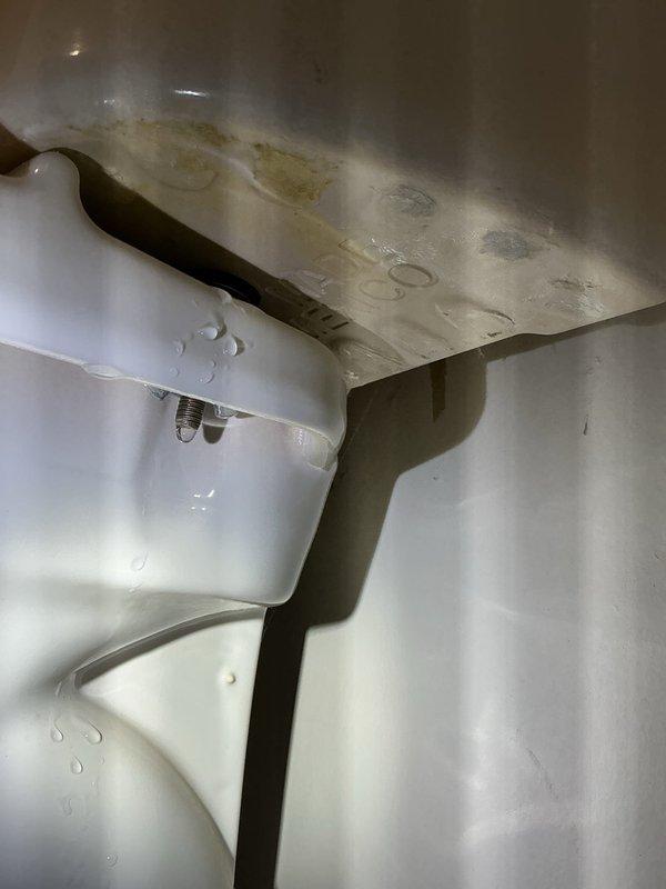 Responded to water leak at toilet base with visible pooling after flushing. Upon inspection, confirmed failed wax ring seal causing water to seep from beneath toilet bowl onto carpeted bathroom floor. Removed toilet, scraped old wax ring and flange residue, inspected closet flange for damage and proper mounting. Installed new wax ring with plastic horn, reset toilet with new closet bolts, torqued to manufacturer specifications, and reconnected water supply line. Tested multiple flush cycles to verify proper seal and confirmed no leakage at base. Advised customer on signs of future seal failure and recommended monitoring for any moisture.