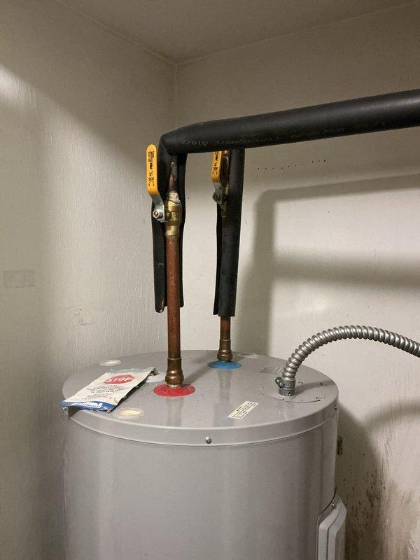 Conducted on-site assessment for 50-gallon electric water heater replacement. Evaluated existing unit installation in utility room, noting current plumbing connections with copper piping, electrical supply configuration, and clearance requirements. Documented water softener and brine tank proximity to ensure adequate workspace access for equipment removal and new unit installation. Provided comprehensive estimate covering complete water heater removal, disposal of old unit, and installation of replacement 50-gallon electric water heater with all necessary connections and code-compliant setup.