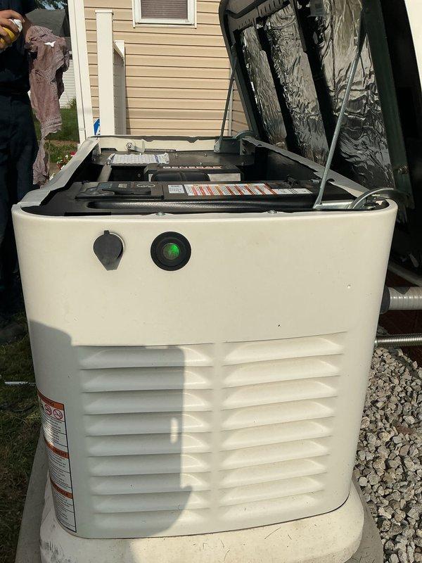 Responded to service call for Generac standby generator continuously running without power outage. Diagnostic evaluation revealed blown N1 and N2 fuses in control panel. Inspection identified corroded battery terminals requiring replacement and maintenance battery at end of service life. Generator unit covered under 10-year comprehensive warranty with annual maintenance requirement, including Generator Value Plan (GVP) coverage for remaining five years encompassing scheduled maintenance, battery replacements, transfer switch repairs, and generator component repairs. Documented findings and confirmed battery and terminal replacement needed under GVP coverage. Photographed generator installation on concrete pad and internal components with access panel open. Service scheduled for 8am to complete necessary repairs.