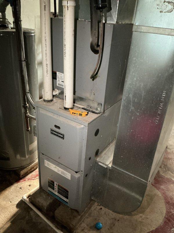 Completed scheduled cooling system maintenance visit on residential air conditioning system. Outdoor condenser unit was found heavily soiled with dirt, mud, and organic debris accumulation on exterior surfaces and coil fins. Performed thorough cleaning of condenser coils and exterior housing to restore proper airflow and heat transfer efficiency. Inspected indoor Command furnace unit and associated refrigerant lines, condensate drainage system, and ductwork in basement. All components found operational with no immediate service needs identified. System returned to normal operating condition following maintenance procedures.