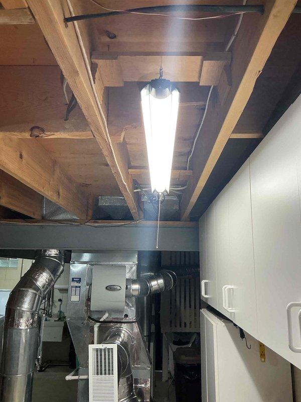 Installed Tesla electric vehicle charging station in garage along with additional electrical outlets. Ran new electrical conduit and wiring through basement utility area, utilizing existing infrastructure pathways along exposed joists and mechanical systems. All installations completed to code specifications with proper circuit protection and grounding.