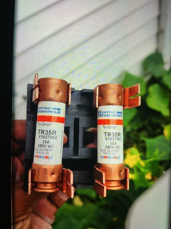 Completed BS-MVP preventive maintenance cooling visit on 2-year-old Lennox outdoor condensing unit. Performed standard system inspection, replaced dual 35A 250V time-delay fuses (Ferraz Shawmut Tri-Onic TR35R), and documented equipment condition with photos. Unit operating properly upon departure.
