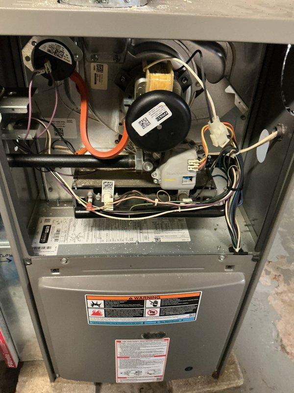 Completed comprehensive tune-up and maintenance on 6-year-old residential HVAC system including both air conditioning and furnace units. Performed full system inspection, verified thermostat operation and calibration as requested, replaced air filter, and documented equipment condition with interior component photography. All components found operating within normal parameters with no issues identified during service visit.