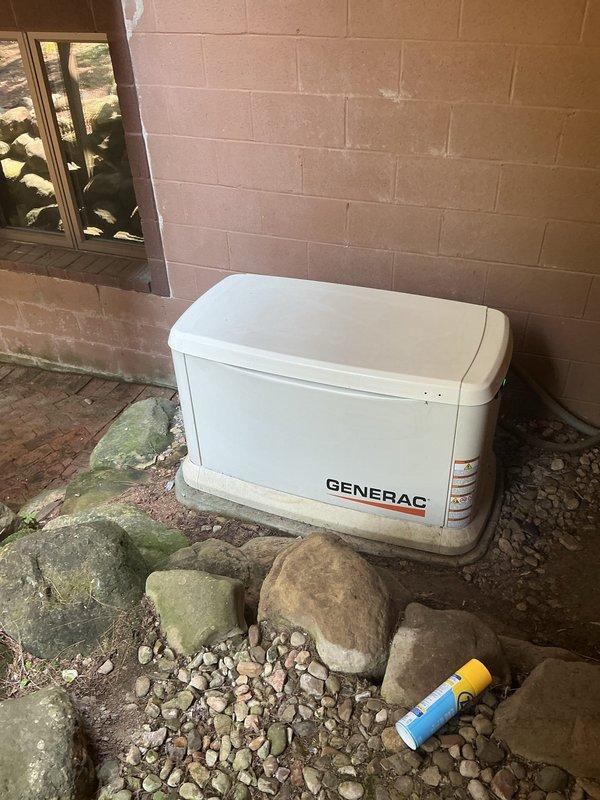Responded to service call for 10-year-old Generac residential backup generator displaying yellow and red warning lights on control panel. Performed diagnostic inspection of unit, evaluated generator disconnect switch position, and assessed electrical connections at breaker panel. Documented current system status with photographic evidence and updated service history tag for maintenance records.