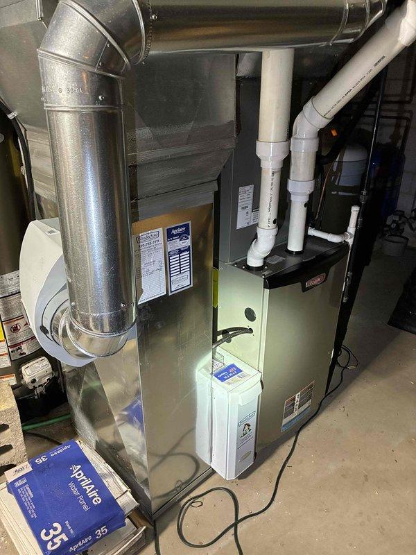 Completed routine cooling maintenance visit on 7-year-old Lennox air conditioning system. Performed comprehensive inspection of indoor furnace unit and outdoor condenser, verified proper operation of all components, checked refrigerant levels, inspected electrical connections and controls, cleaned condenser coils, confirmed adequate airflow through system, and noted Aprilaire filter present for replacement. System operating within normal parameters with no immediate service needs identified.