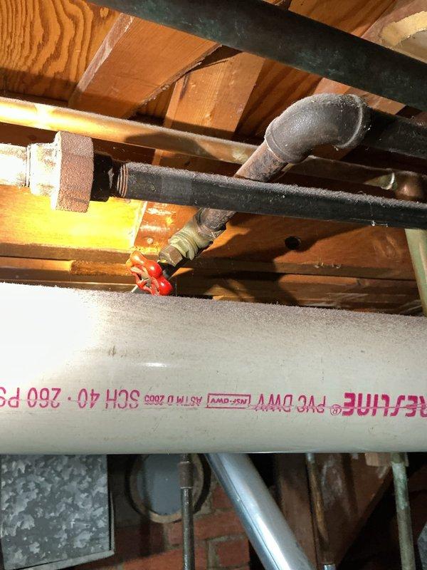 Responded to clogged main line in 40+ year old residential property. Successfully snaked the interior main drain line to clear blockage and restore proper drainage flow. Documented existing plumbing infrastructure including PVC main line, copper supply lines, and iron drain pipes in basement area for service records.