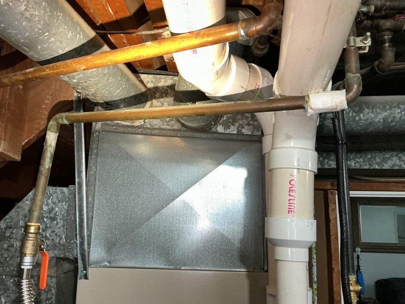 Responded to clogged main line in 40+ year old residential property. Successfully snaked the interior main drain line to clear blockage and restore proper drainage flow. Documented existing plumbing infrastructure including PVC main line, copper supply lines, and iron drain pipes in basement area for service records.