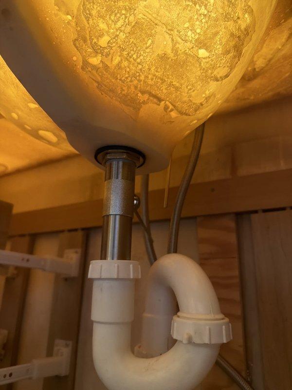 Installed two new basket strainers with complete tubular drain assemblies beneath dual lavatory sinks. Reworked existing drain system to incorporate an air admittance valve, ensuring proper venting and drainage performance. Replaced two lavatory faucets with new fixtures, including installation of new shut-off valves for both hot and cold water supply lines. All connections were tested for proper operation and leaks upon completion.