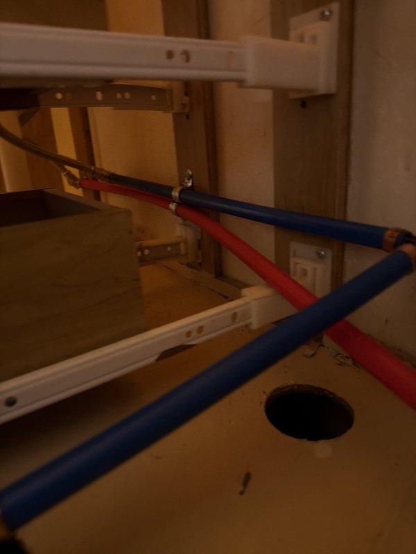 Installed two new basket strainers with complete tubular drain assemblies beneath dual lavatory sinks. Reworked existing drain system to incorporate an air admittance valve, ensuring proper venting and drainage performance. Replaced two lavatory faucets with new fixtures, including installation of new shut-off valves for both hot and cold water supply lines. All connections were tested for proper operation and leaks upon completion.