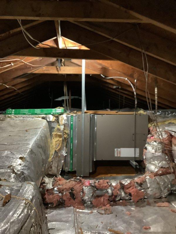 Conducted comprehensive HVAC system evaluation for complete replacement estimate. Assessed existing Coleman outdoor condensing unit mounted on concrete pad with refrigerant lines and electrical conduit routing along exterior wall. Inspected attic-mounted air handler system with associated ductwork, PVC condensate drainage, and electrical connections. Documented current equipment condition, installation configuration, and surrounding insulation integrity. Provided detailed replacement proposal for complete system upgrade.