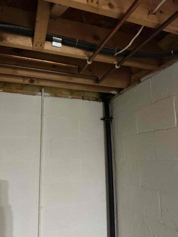 Installed two bathroom ventilation fans in residential property to improve air circulation and moisture control. Ran electrical wiring through basement ceiling joists to power units, secured conduit and connections per code requirements, and verified proper operation of both exhaust fans upon completion.