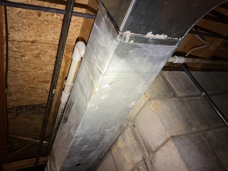 Repaired a leaking 1-inch PVC well line in the basement where corrosion had developed at a swing joint with two elbows. Shut down the well system, cut out the corroded section on both sides, and rebuilt the connection with new couplings and replacement elbows using proper PVC cement. Advised that the glue requires a 24-hour curing period before the well breaker can be turned back on to restore system operation.