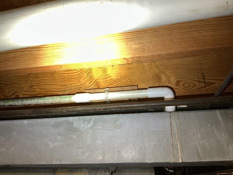 Repaired a leaking 1-inch PVC well line in the basement where corrosion had developed at a swing joint with two elbows. Shut down the well system, cut out the corroded section on both sides, and rebuilt the connection with new couplings and replacement elbows using proper PVC cement. Advised that the glue requires a 24-hour curing period before the well breaker can be turned back on to restore system operation.