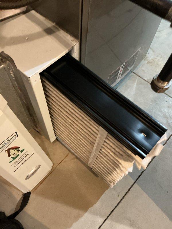 Completed comprehensive air conditioning maintenance inspection on residential HVAC system. Performed system diagnostics including temperature readings at ductwork (measured 96.9°F at supply plenum), inspected air handler cabinet and evaporator coil housing for proper operation, and verified all mechanical components and duct connections were secure and functioning within normal parameters.