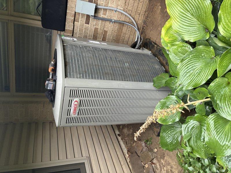 Completed BS-MVP cooling maintenance visit on 2-year-old air conditioning system. Performed comprehensive inspection of indoor air handler unit, verifying proper operation of blower motor assembly, electrical connections, and control boards. Inspected outdoor condensing unit positioned on deck, checking refrigerant coils, electrical conduit connections, and overall system operation. All components found in good working condition with no immediate service needs identified. Unit confirmed operational and ready for continued cooling season performance.