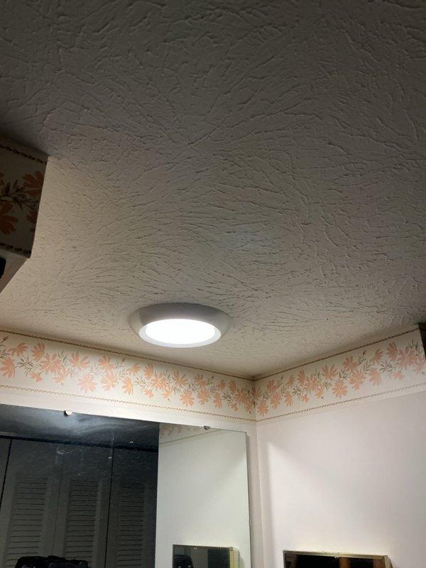 Replaced two existing light fixtures with modern LED recessed panel lights in the upstairs hallway and bedroom. Additionally, replaced a faulty GFCI receptacle in the upstairs bathroom to restore proper ground fault protection.